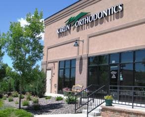 The Karlin Orthodontics office building on Dorchester Street, with the practice's sign above the entrance